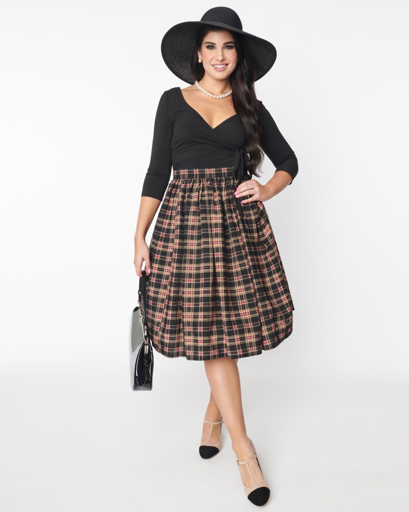 Front of a model wearing a size L Unique Vintage Black & Burgundy Plaid Gellar Swing Skirt in Black & Burgundy Plaid by Unique Vintage. | dia_product_style_image_id:316847